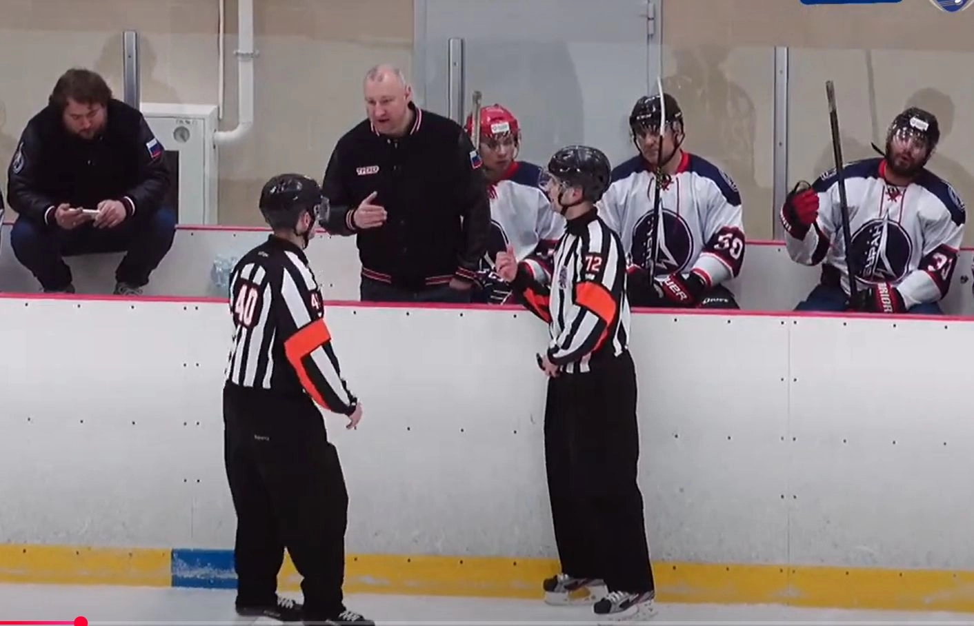 Igor Musatov coaches a hockey game