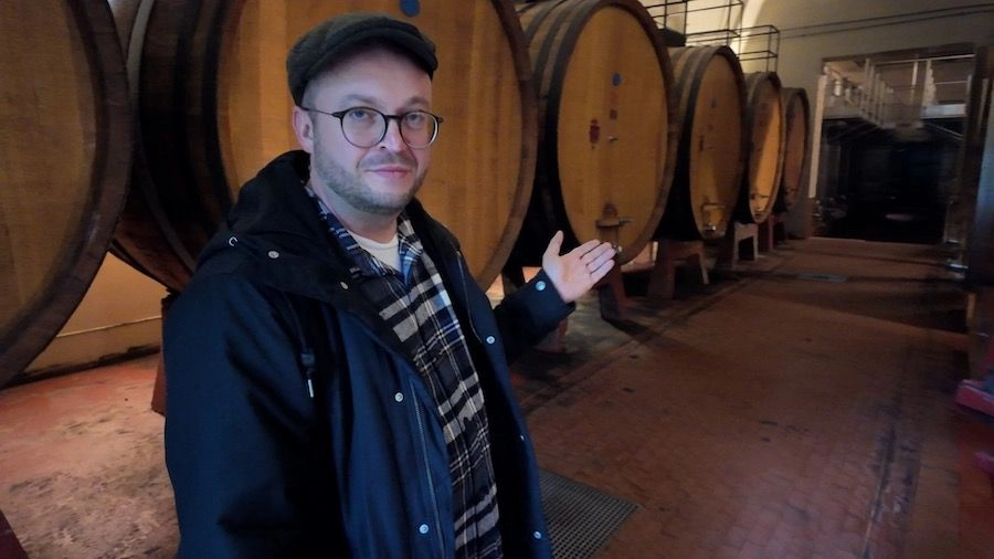 The author of the investigation pictured next to Dmitry Medvedev's wine barrels