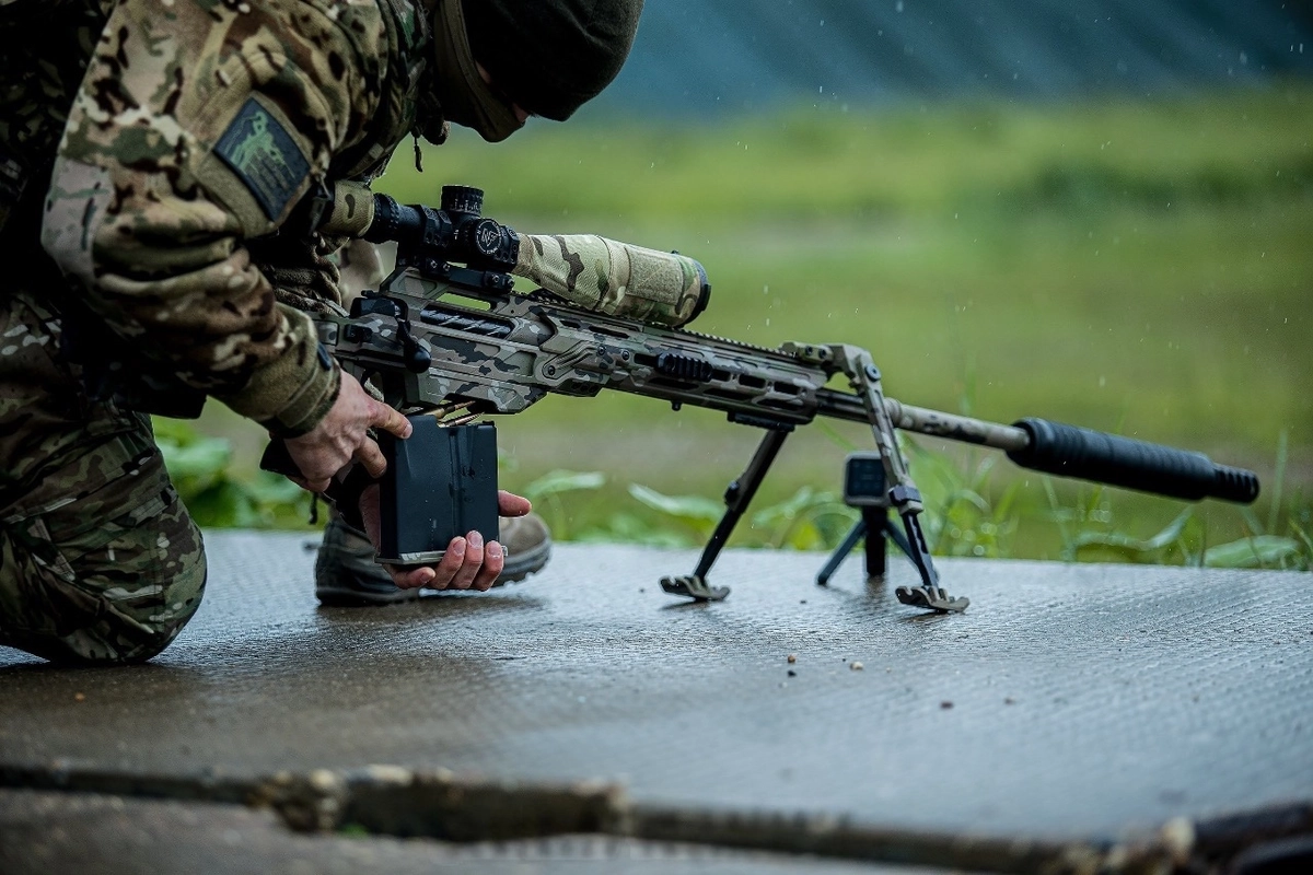 A sniper equipped with a Canadian CDX-40 SHDW rifle and an American Nightforce scope at a tactical shooting tournament organized by the Main Directorate for Combat Training of the Russian Armed Forces, June 2025